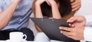 Legal advisor assisting worried couple